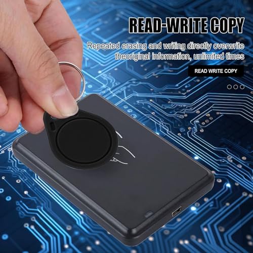 Black key fob tags being used with a handheld RFID writer tool for credential cloning