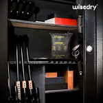 Reactivating Wisedry silica gel dehumidifier in a microwave oven.