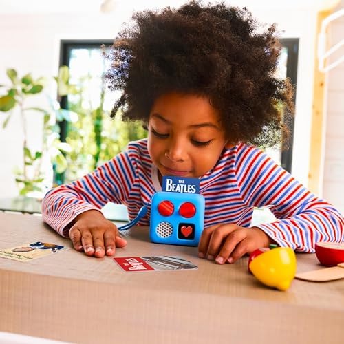 Yoto Mini electronic travel speaker functioning as an OK to wake nightlight clock on a bedside table