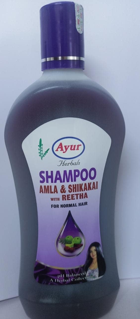 Ayur Herbals shampoo bottle showing herbal extract details