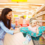 Washable baby shopping cart cover folded neatly into its attached travel pouch.