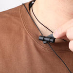 Lightweight clothing clip for earphone cord attached to a shirt collar
