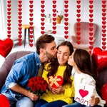 Full product display of the AinDen ninety six piece Valentine decoration set showing all hanging strands together