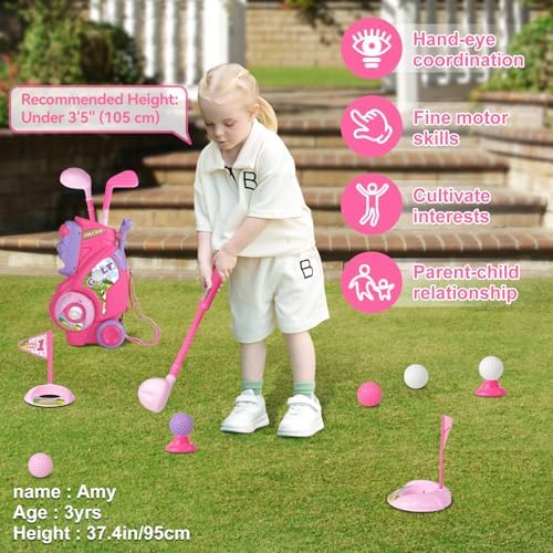 Toddler playing with pink golf set outdoors