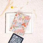 Zosiana Designs floral sleeve held in hand for size reference
