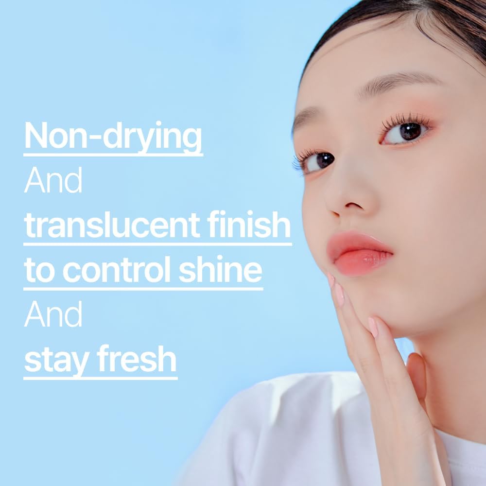 ETUDE matte finish translucent powder being applied to face with puff