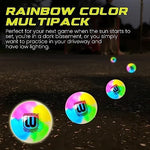 Three multicolored sixty-five millimeter street hockey balls arranged neatly