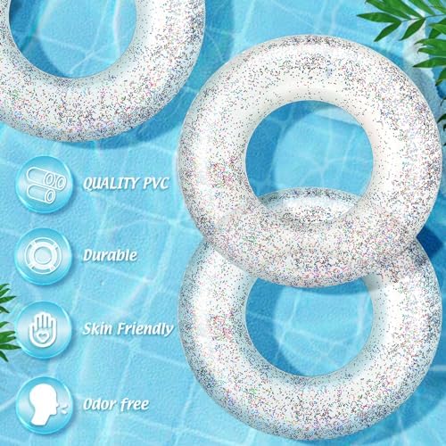 Group of durable Wettarn glitter-infused inflatable water tubes arranged on an outdoor sunny beach.