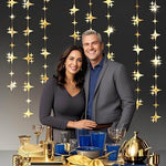 A lifestyle setup of the Yilzo gold star banner decorating a baby shower venue
