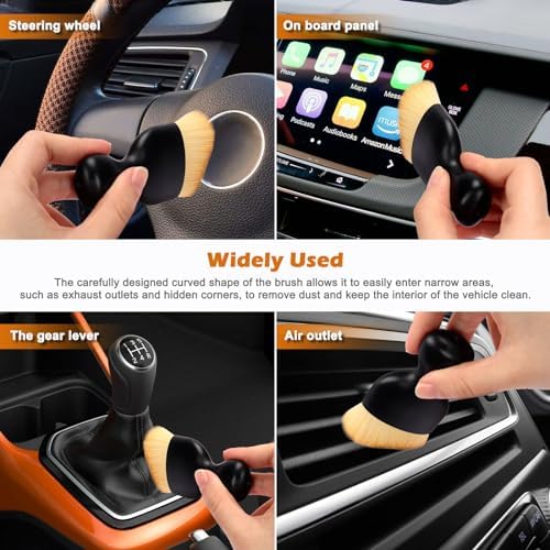 Plush microfiber towel wiping down a glossy automotive center console surface without streaks.