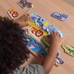 Durable wooden puzzle pieces with easy grasp pegs being lifted to reveal matching pictures beneath