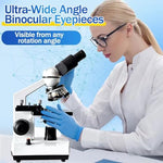 High magnification compound microscope close up on the dual wide angle eyepieces and Abbe condenser spotlight.