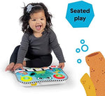 Close-up view of the five individual sensory buttons on the Baby Einstein turtle pad featuring geometric shapes and numbers.