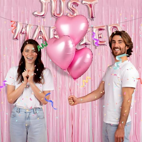 Bachelorette party photo booth background featuring light pink metallic curtains