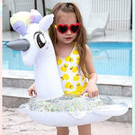 Toddler using Cicitoywo unicorn pool float in water