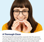 Person applying EverSmile AlignerFresh foam to their orthodontic aligners