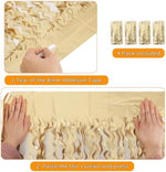 Elegant birthday photo booth setup utilizing layered wavy metallic tinsel backdrops