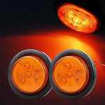 High intensity red rear marker light illuminated on dark background