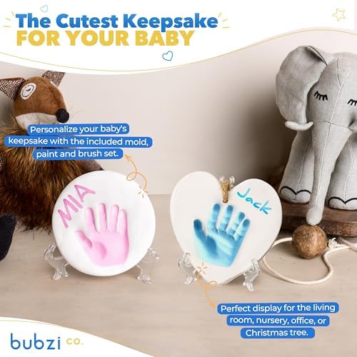 Newborn baby handprint impression on circle shaped white clay ornament