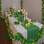 Bright green and gold tinsel garland hanging neatly along a classroom whiteboard for holiday celebrations.