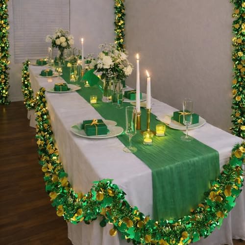 Bright green and gold tinsel garland hanging neatly along a classroom whiteboard for holiday celebrations.