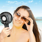 Miady portable personal fan being held to demonstrate compact ergonomic design and lightweight structure