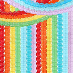 Baby shower venue setup showcasing vibrant red orange yellow green blue purple banners.