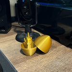 Sarcastic humor office prank gift gold egg next to holiday decorations