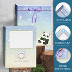Side angle view of the premium blue hardcover baby record book alongside its matching protective storage box