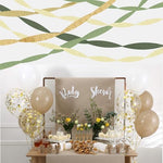 Close up look at the textures of sage green dark green and gold crepe paper rolls.