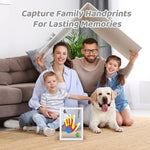 Close up of layered acrylic sheets showing multicolored baby and parent handprints.