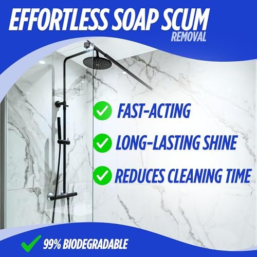Oh Yuk vegan shower cleaner spray being used on a glass shower door to remove hard water stains.