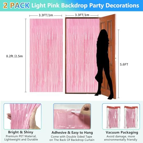 Two packs of baby pink metallic tinsel streamers hanging on a party wall