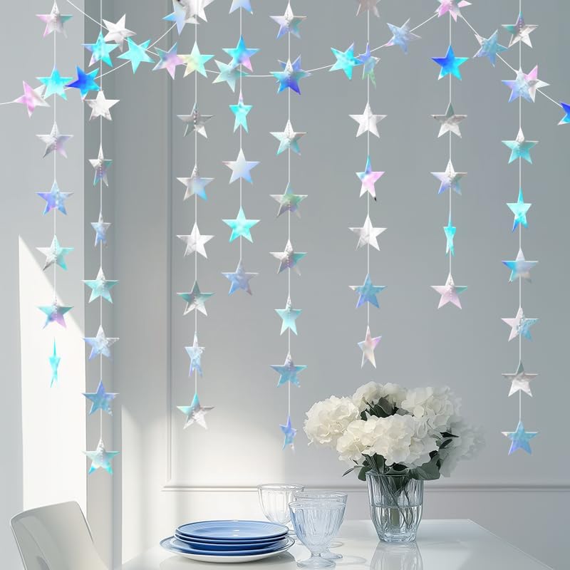 Holographic star garland decorations draped across a window frame for a birthday celebration