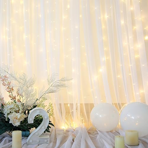 Suppromo ten by eight feet white sheer backdrop curtains styled as an elegant photo booth background