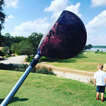 Golf course baby gender announcement with exploding golf balls