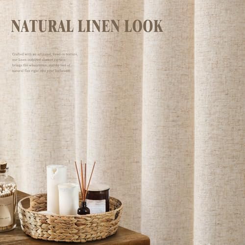 Cream cotton style neutral cloth drape hanging elegantly in a modern bathroom