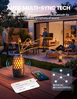 BolaButty wireless lantern speaker casting a flickering flame effect on a dark patio table
