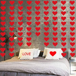 Three strands of pre strung Valentine decorations displayed neatly over a romantic dessert table setup