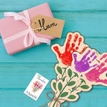 Toddler completing a personalized handprint craft on the premium wood surface for a Mother's Day memory gift