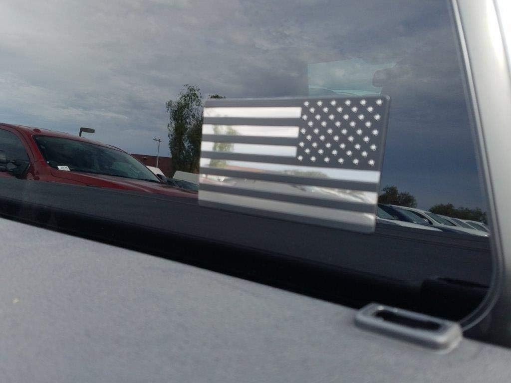 Rear tailgate application view of black American flag car emblem