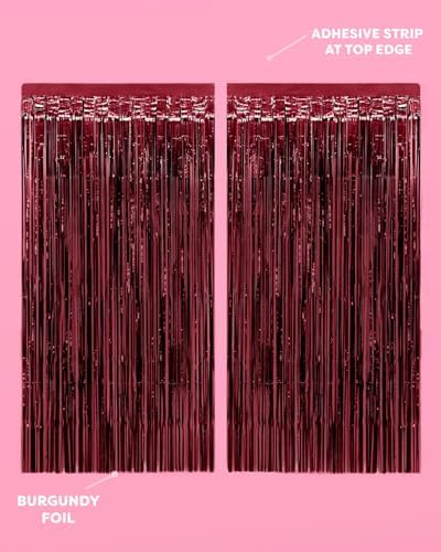 Xo Fetti shimmering maroon foil fringe curtain hanging over a standard doorway frame