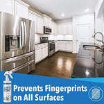 Anti fingerprint ceramic spray being applied to a stainless steel refrigerator door with a microfiber cloth.
