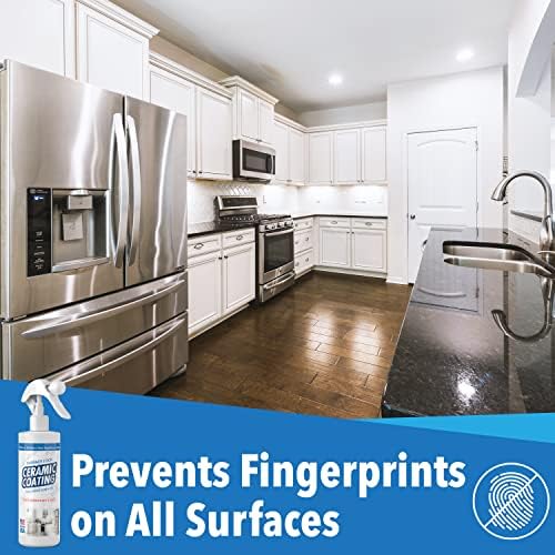 Anti fingerprint ceramic spray being applied to a stainless steel refrigerator door with a microfiber cloth.