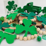 Generic rustic Irish holiday garland draped beautifully across a three tiered wooden display tray.