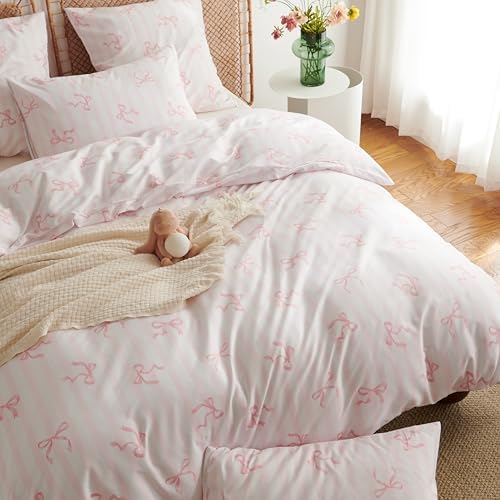 Two matching pink striped pillowcases with envelope closures displayed on pillows