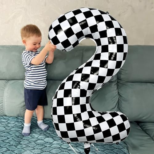 Premium black and white grid patterned digital one balloon displayed as a first birthday party photo prop.