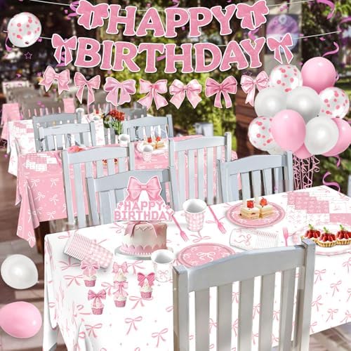 Table setting with pink bow tablecloth and tableware