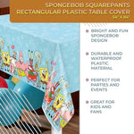 Full view of the 54 by 84 inches rectangular plastic tablecloth draped over a standard dining table setup.