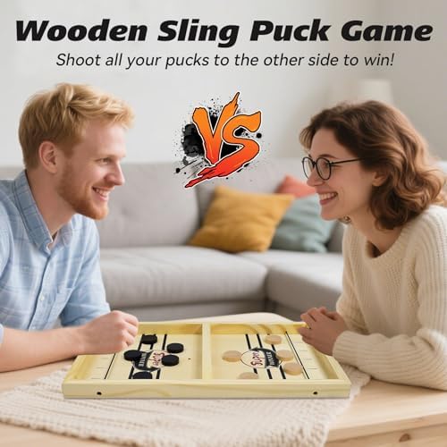 Bakam wooden slingshot board game for two players during active gameplay